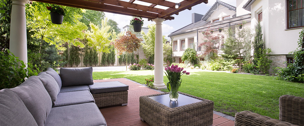 Garden furniture under pergola.