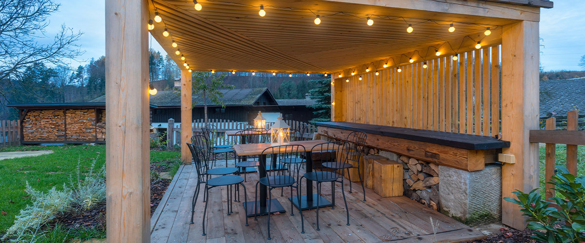 Outdoor dining area under gazebo.