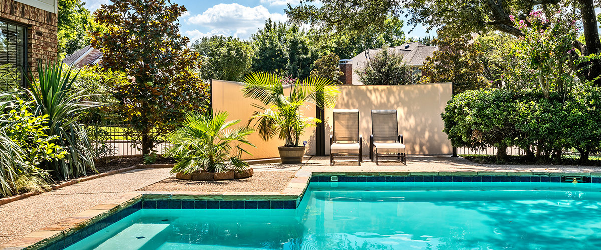 Private backyard with pool.