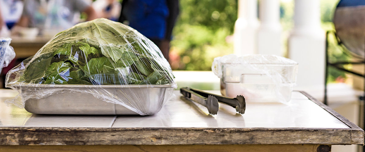 Covered lettuce on table outside