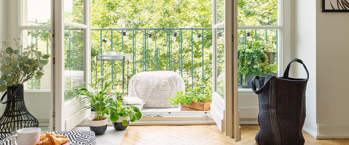Room outlooking towards balcony with lots of greenery