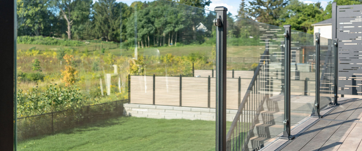 Glass railing overlooking backyard